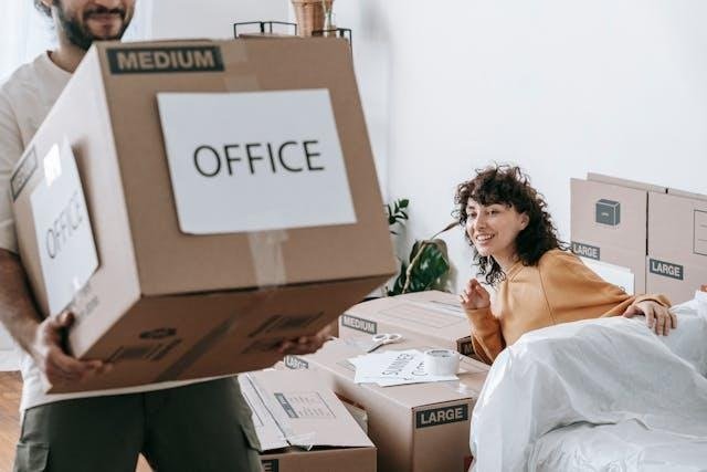 A man carrying a cardboard box while a girl is looking at him